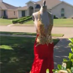 Hand stitched custom prom dress with gold stitching and a beautiful velvet fan.